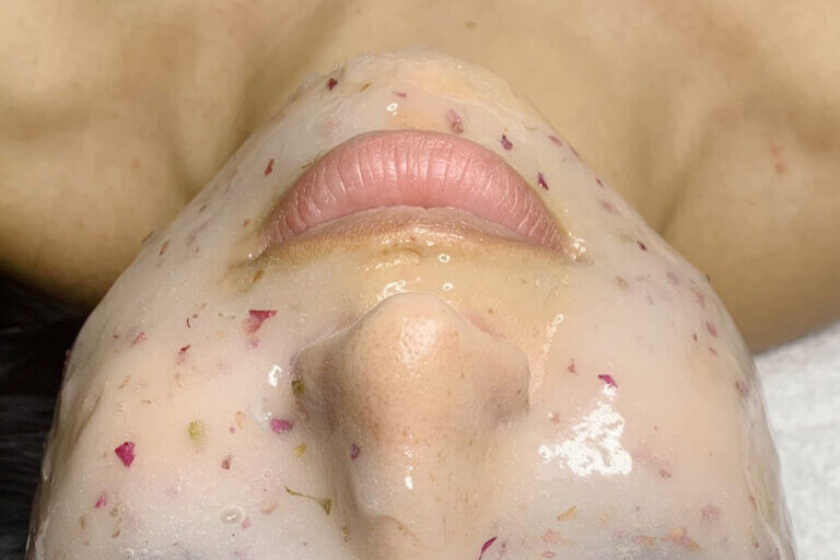 Woman's face has spa facial mask