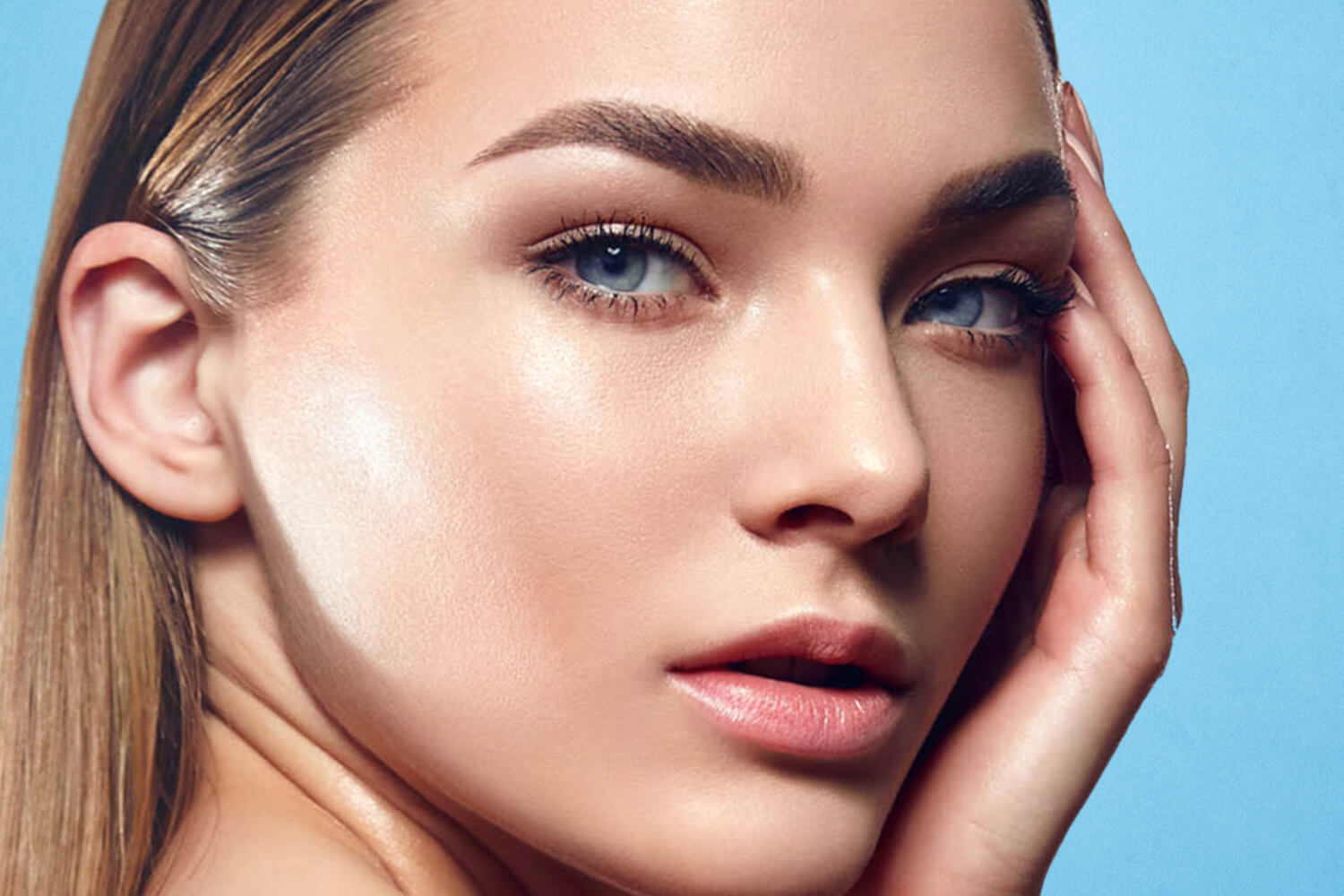 Model posing and touching her face