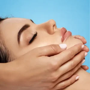 a female's face being massaged
