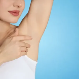 a woman touches her underarm